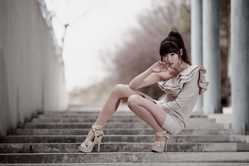 Woman in Dress on Stairs — Beige