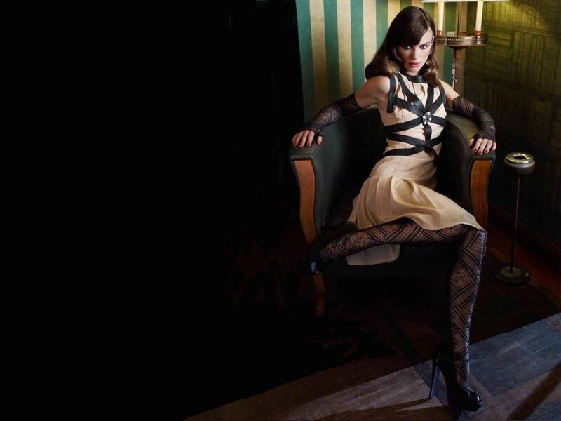 Woman in Dress Sitting — Black, Dramatic