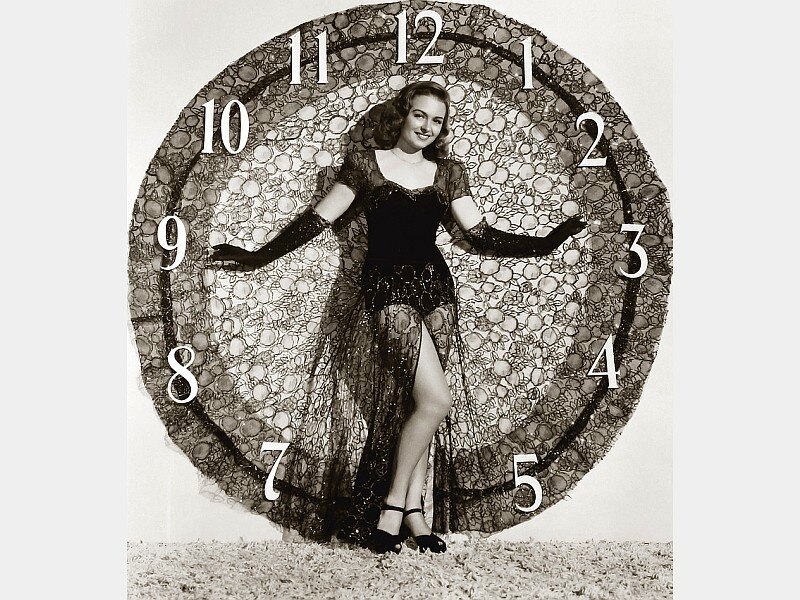 Woman in dress with clock backdrop