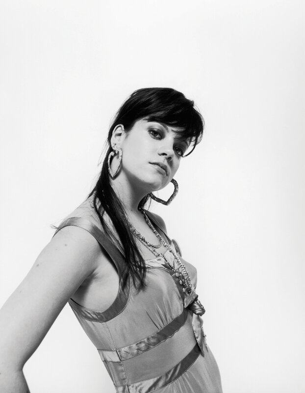 woman in dress with hoop earrings