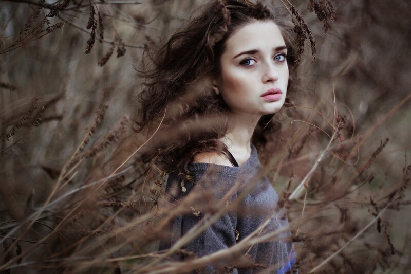 woman in dry grass field