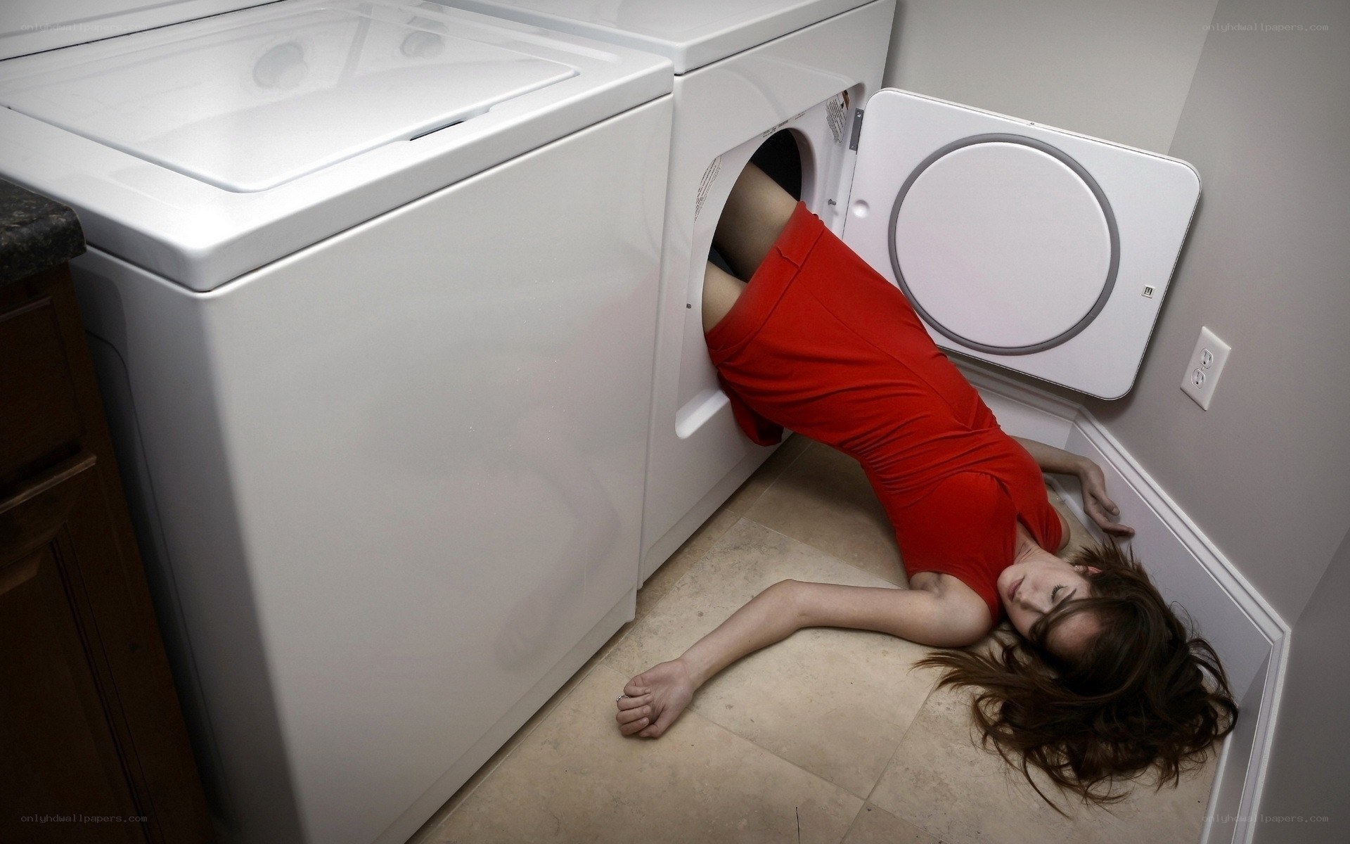 Woman in dryer machine