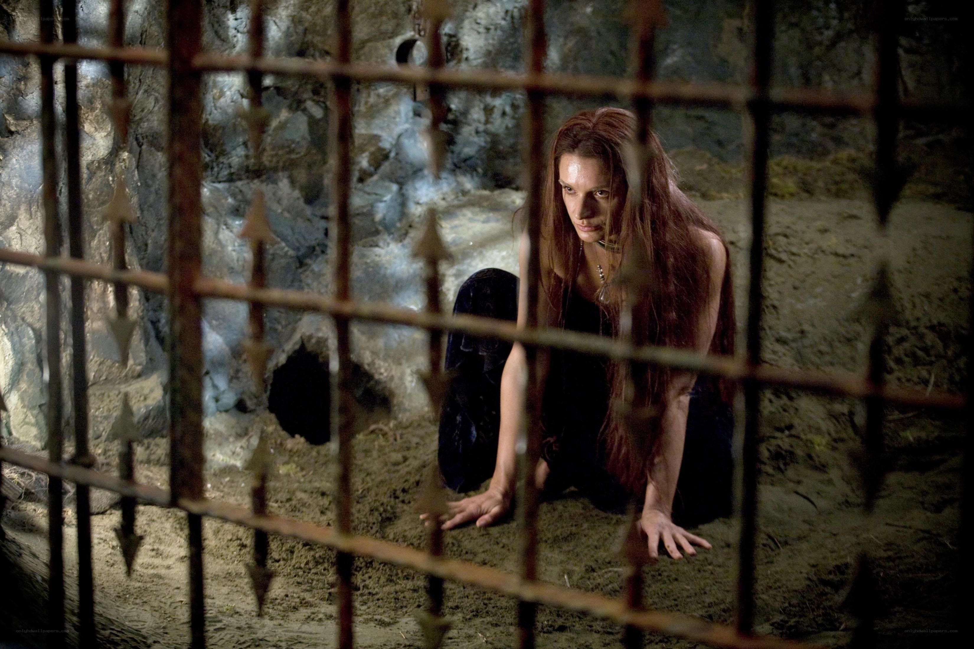 woman in dungeon cell