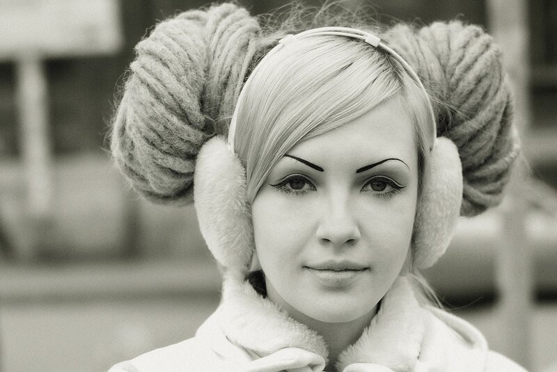 woman in earmuffs and braids