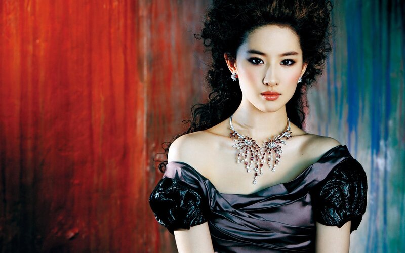 woman in elegant dress and jewelry