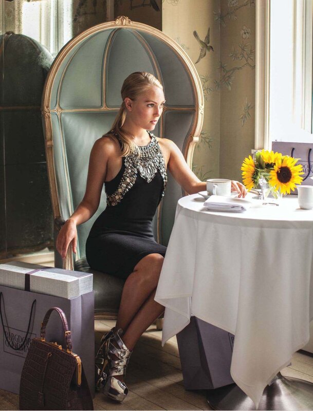 Woman in elegant dress at table