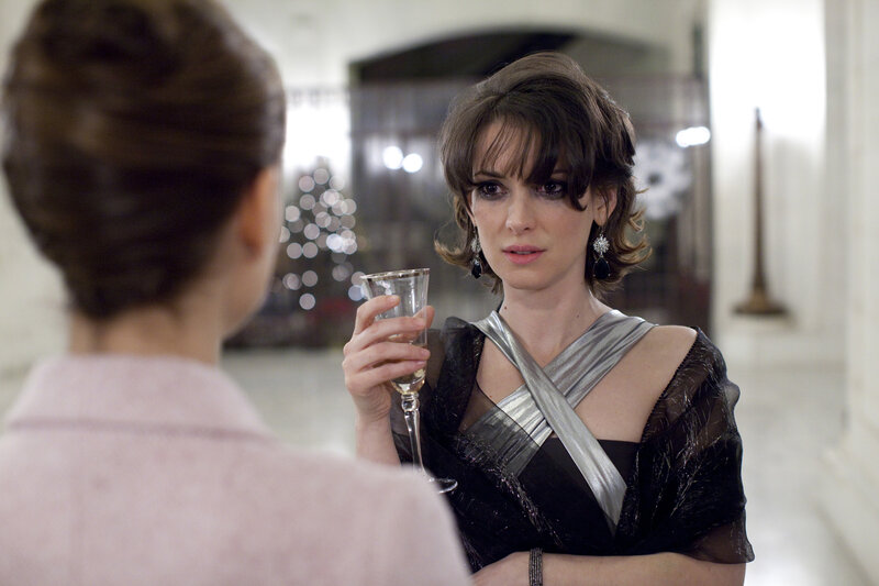Woman in elegant dress holding glass