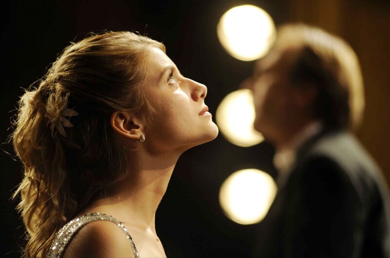 woman in elegant dress looking up
