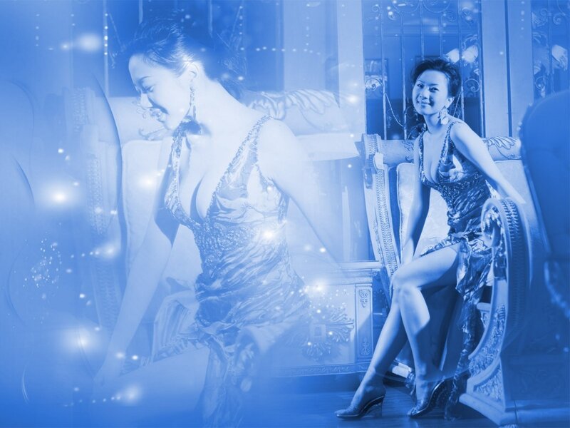 woman in elegant dress on couch
