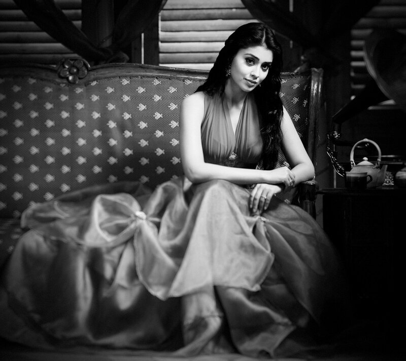 woman in elegant dress on sofa