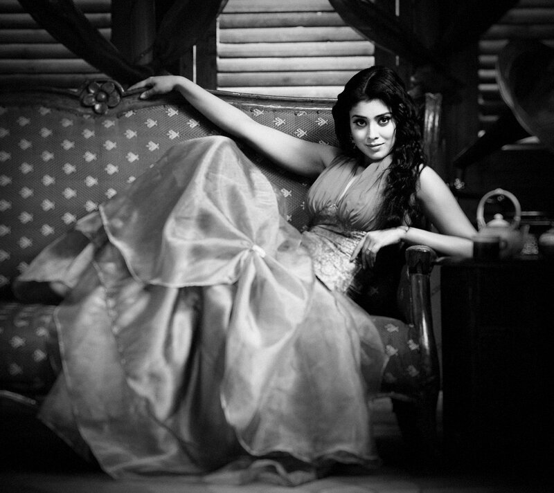 woman in elegant dress on sofa