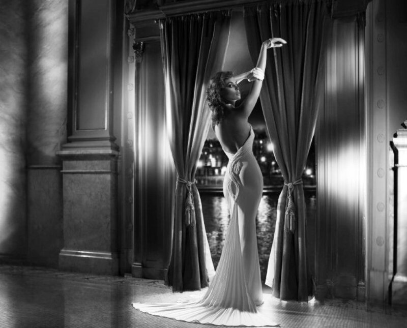 woman in elegant gown on balcony