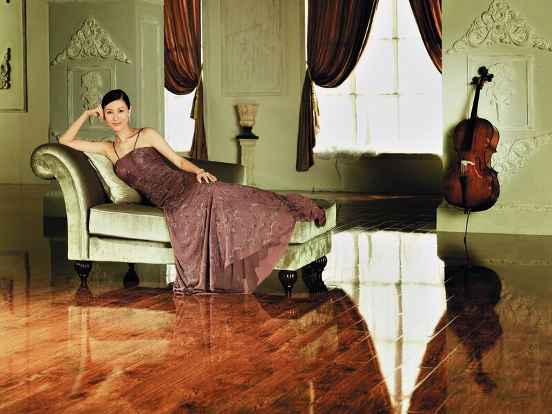 Woman in elegant gown on chaise