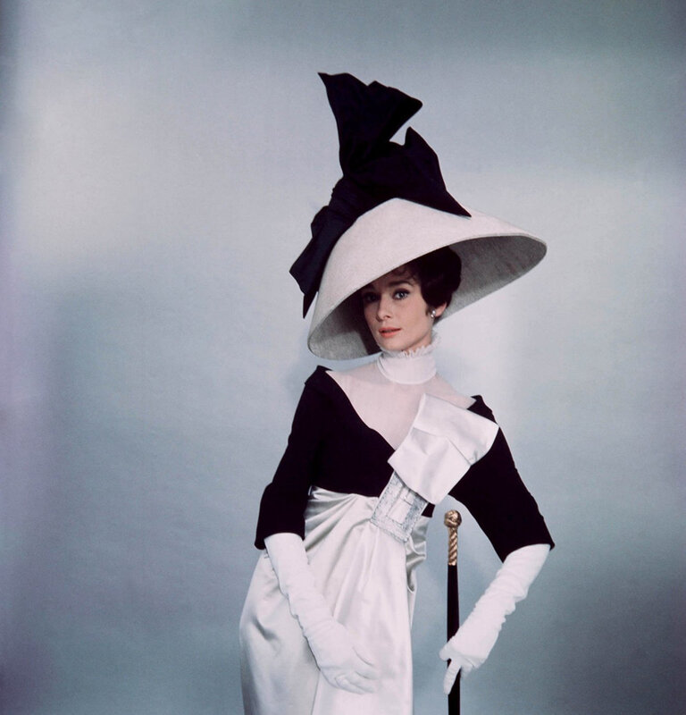 Woman in elegant hat and dress