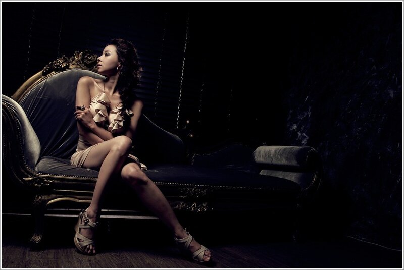 woman in elegant pose on chaise