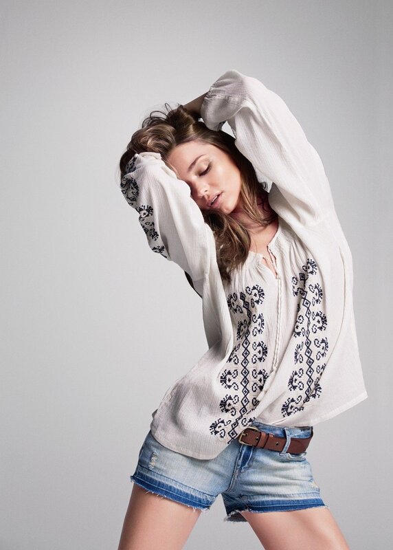 woman in embroidered blouse