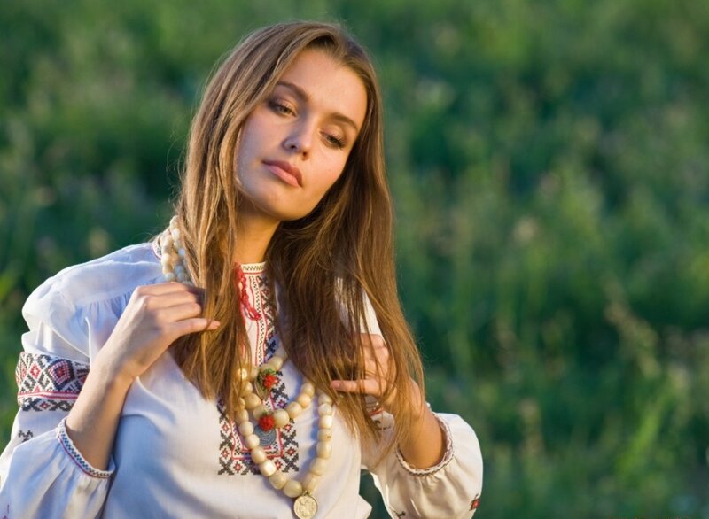 Woman in Embroidered Blouse — White