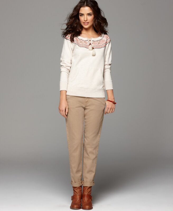 woman in embroidered sweatshirt