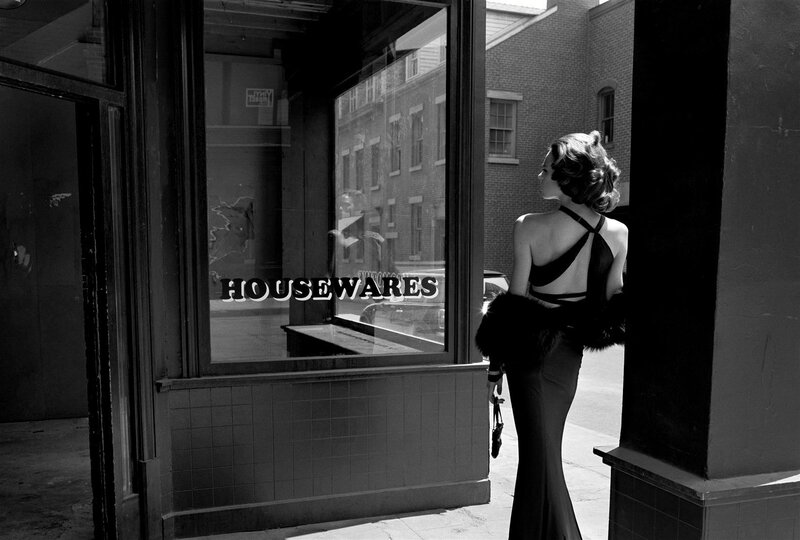 Woman in evening dress at storefront