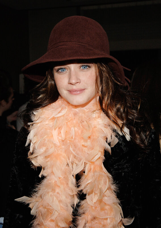woman in feather boa and hat