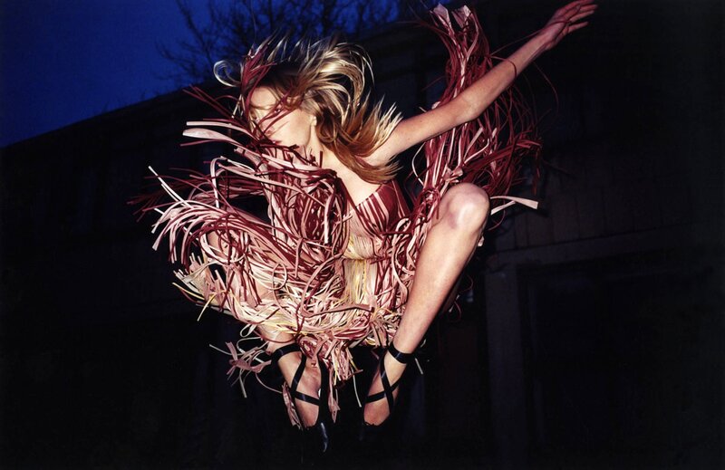 woman in feathered costume