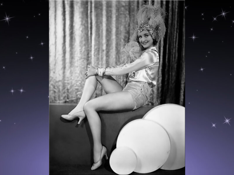 Woman in Feathered Costume — Black, Dramatic, Photograph, Feather Hat, Curtain