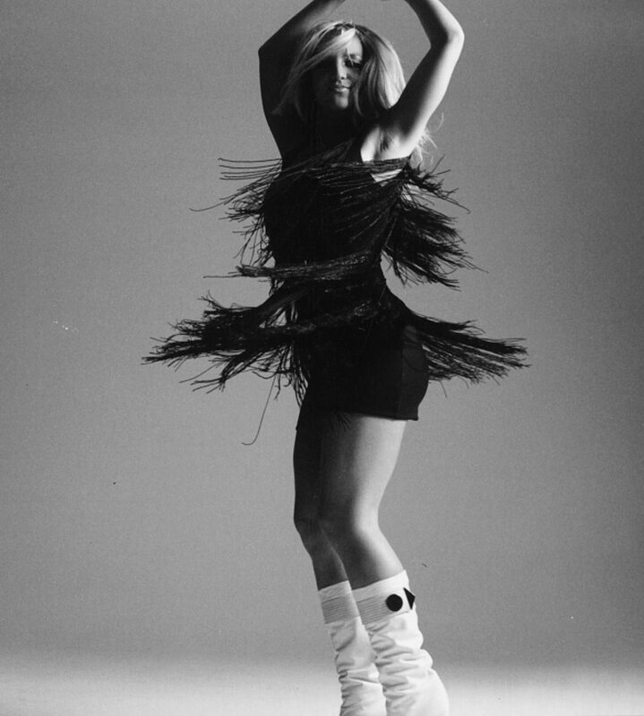 woman in feathered dress dancing