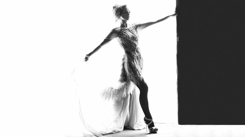 woman in feathered dress posing