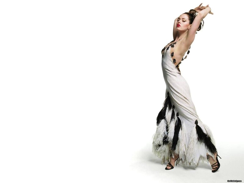woman in feathered gown dancing