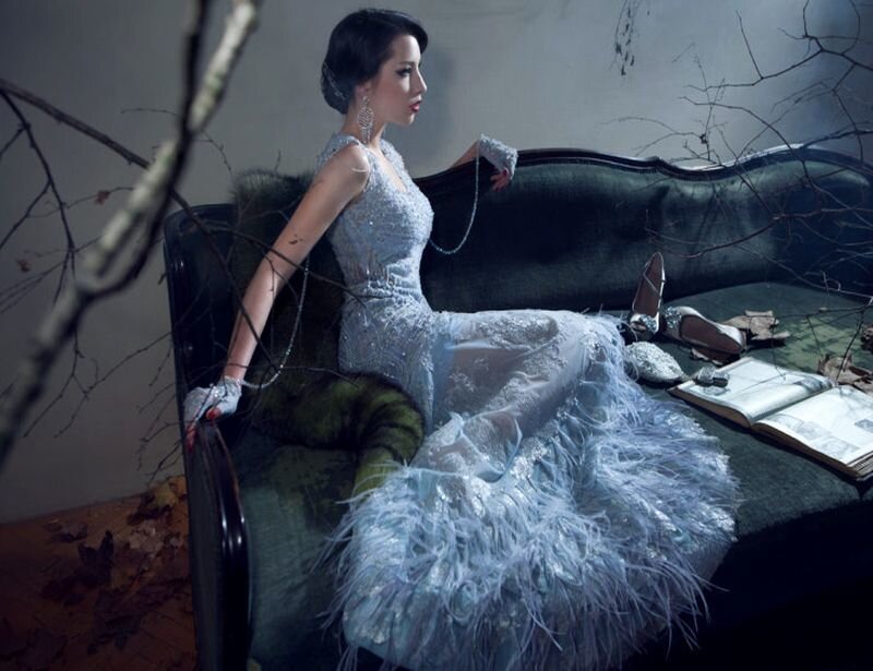 Woman in Feathered Gown