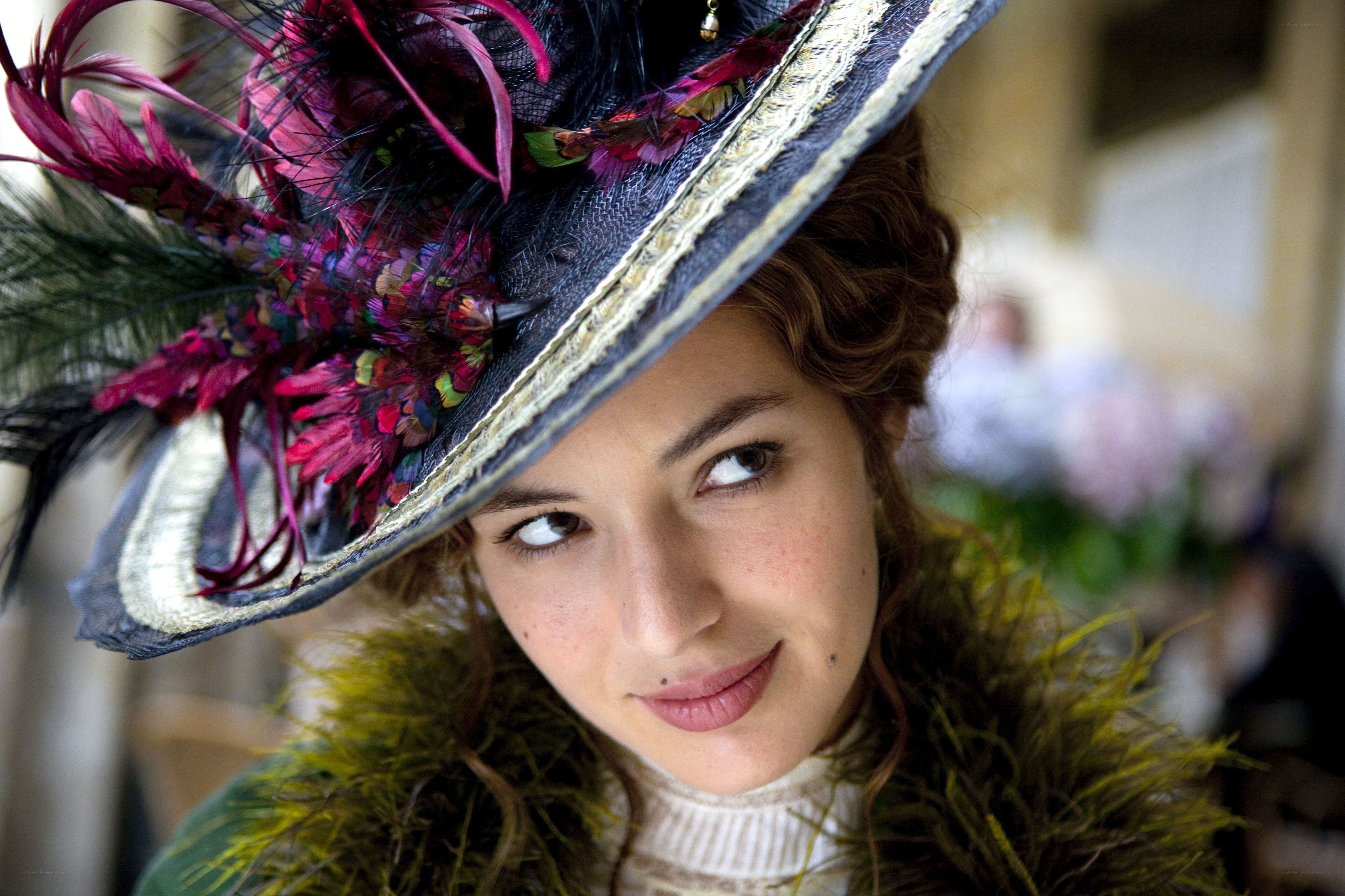woman in feathered hat