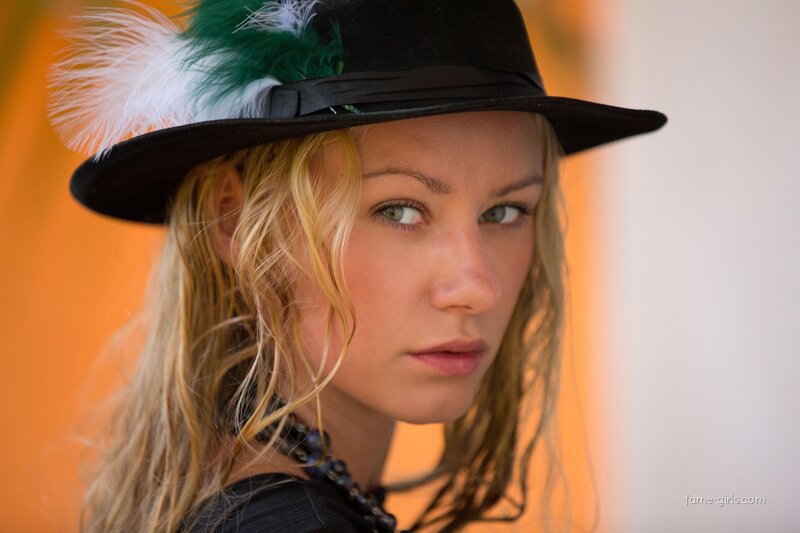 woman in feathered hat
