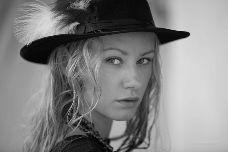 woman in feathered hat