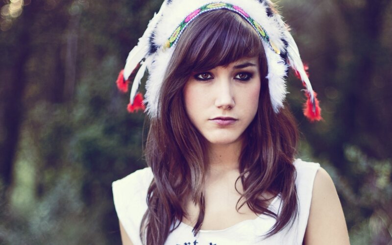 woman in feathered headband