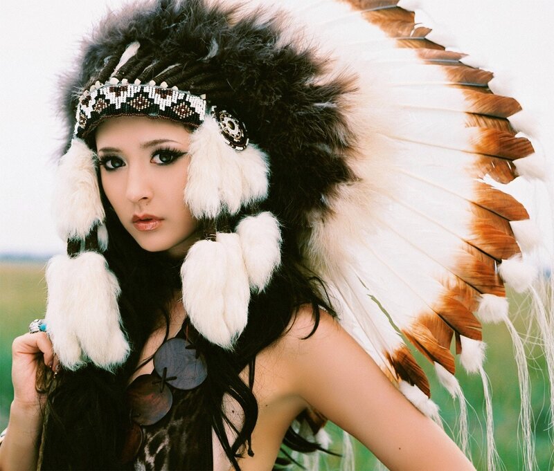 woman in feathered headdress