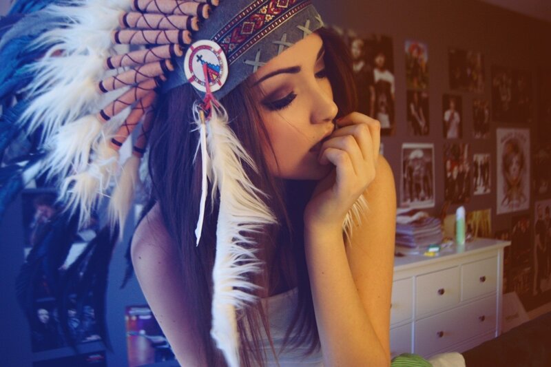 woman in feathered headdress