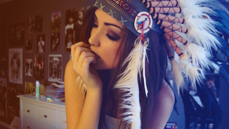 woman in feathered headdress