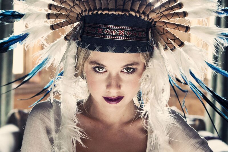 woman in feathered headdress