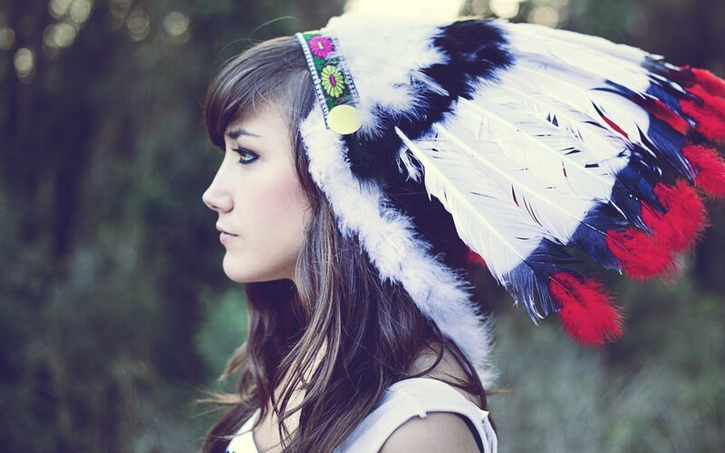 woman in feathered headdress
