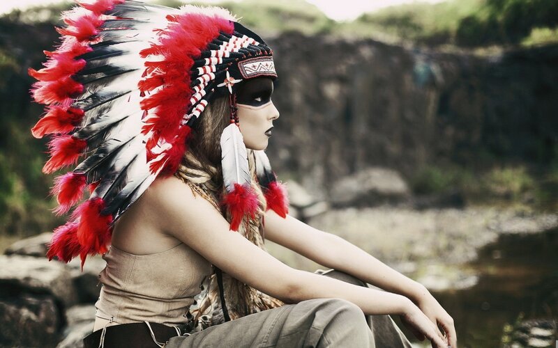 woman in feathered headdress
