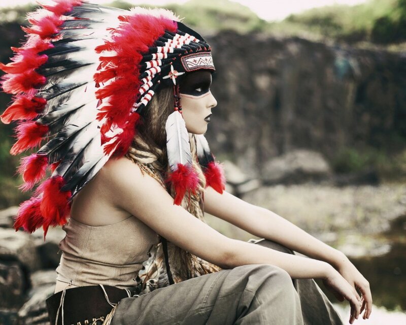 woman in feathered headdress