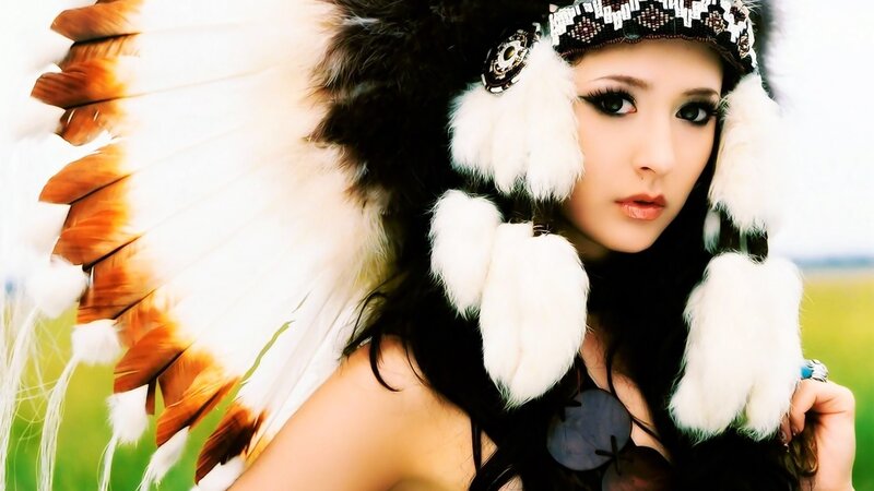 woman in feathered headdress
