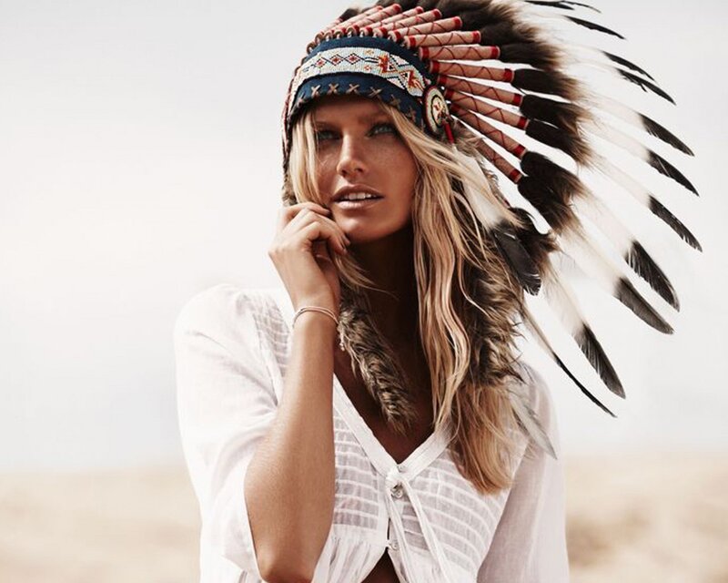 woman in feathered headdress