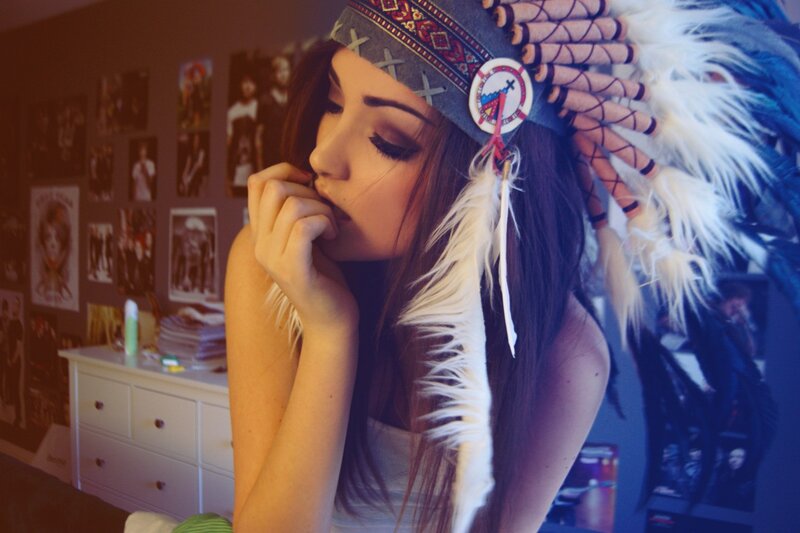 woman in feathered headdress