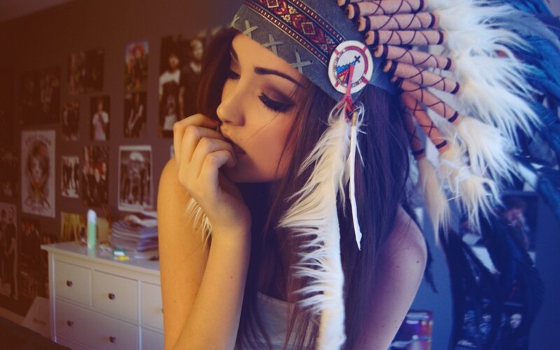 woman in feathered headdress