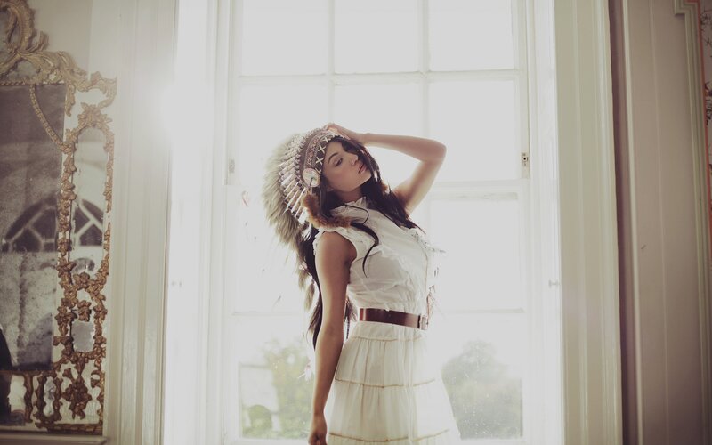 Woman in Feathered Headdress — White, Serene, Afternoon