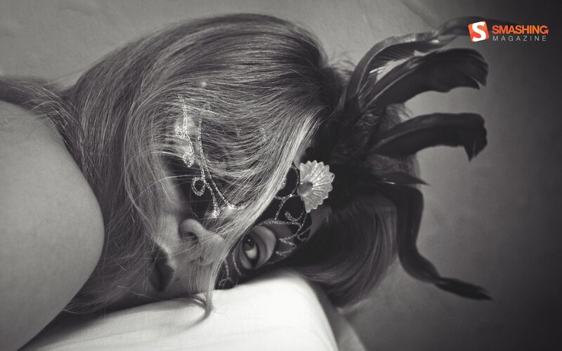 woman in feathered mask