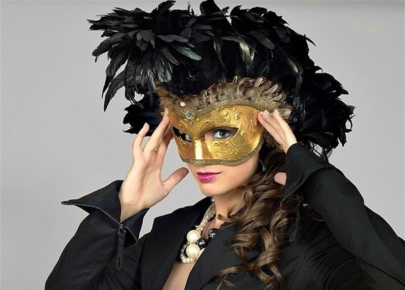 woman in feathered mask