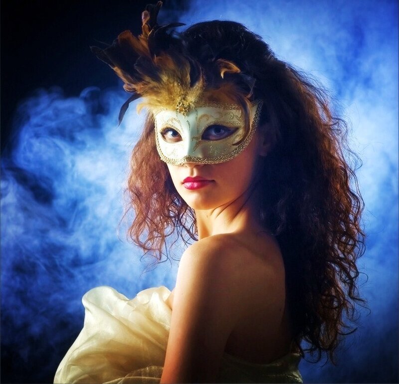 woman in feathered mask