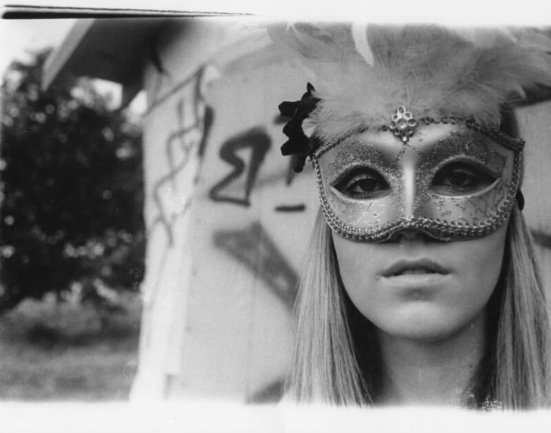 woman in feathered mask
